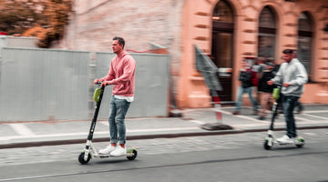 Men rides electric scooters 