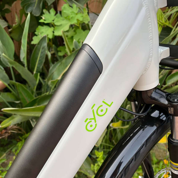 The handlebars of a CYCL e-bike with a green logo.