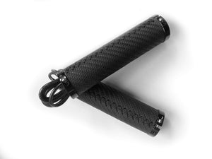 A pair of CYCL Heated Handlebar Grips on a white surface, perfect for bicycles.