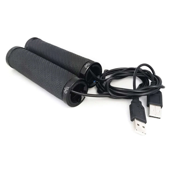 A pair of black usb cables connected to a white surface with CYCL Heated Handlebar Grips.