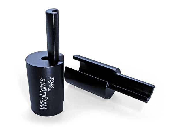 A black plastic holder with a black handle, featuring ergonomic design for comfort during extended use, the WingLights Aluminium Adaptor for Electric Scooters by CYCL.