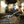 Load image into Gallery viewer, A WingLights v3 Mag by CYCL is blinking on a parked bike in a dark alleyway.
