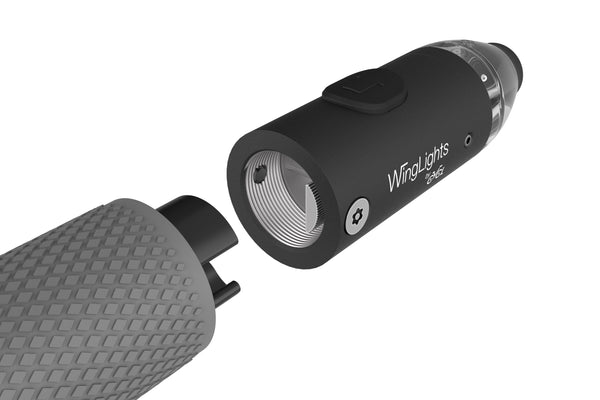 A black and white image of a WingLights nExt device with a light attached to it by CYCL.